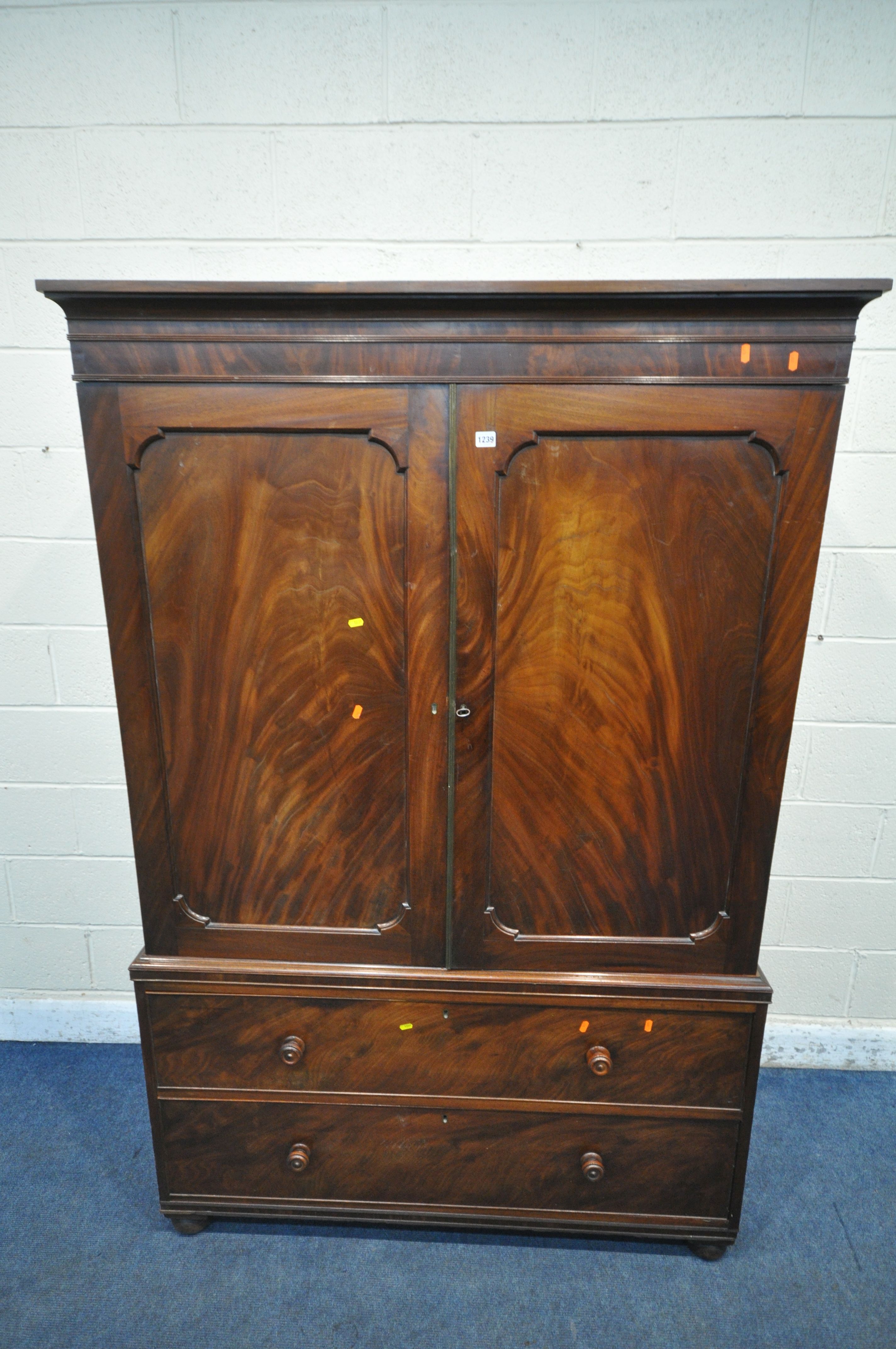 A 19TH CENTURY MAHOGANY LINEN PRESS, fitted with double cupboard doors, above two drawers, width