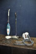 A TESCO PULL ALONG VACUUM CLEANER, a G Tech cordless vacuum with power supply and a Vax carpet