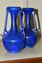 A PAIR OF EARLY 20TH CENTURY BRETBY POTTERY TWIN HANDLED VASES, shape no.1565C, mottled blue /green/