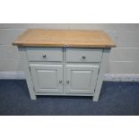 A MODERN LIMED OAK AND CREAM SIDEBOARD, fitted with two drawers, above two cupboard doors, width