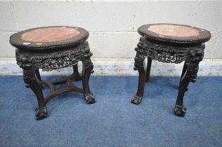 TWO CHINESE HARDWOOD SIDE TABLES, each with a pink marble insert, intricate carved details to
