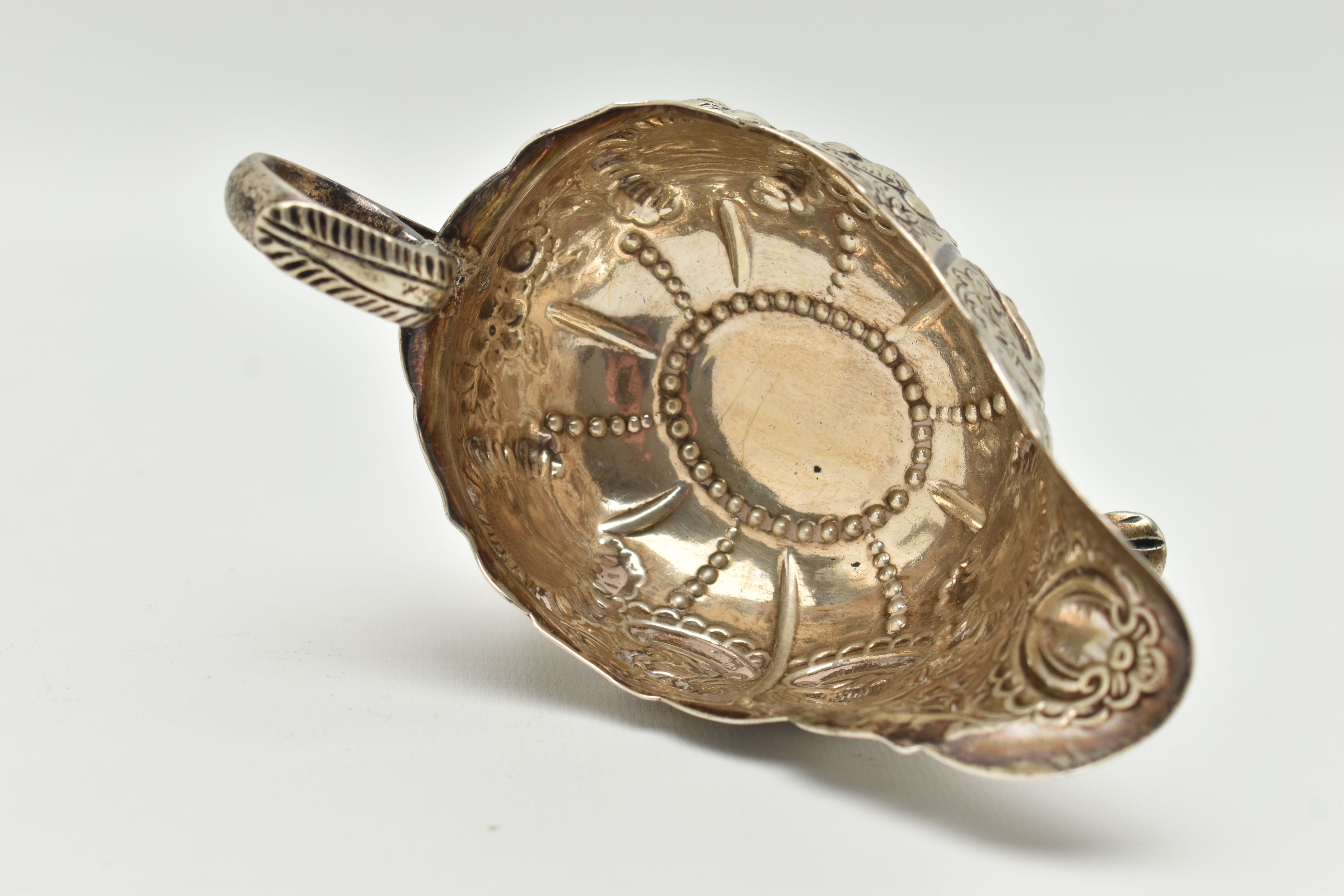 AN IRISH SILVER GRAVY BOAT, early 20th century, embossed animal and floral pattern, with three - Image 6 of 6