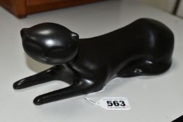 AN UNMARKED BLACK GLAZED RECUMBANT CAT IN THE STYLE OF CMIELOW, length 23.5cm (Condition Report: