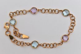 A 9CT GOLD GEM SET LINE BRACELET, designed as a circular link bracelet set with two circular cut