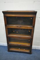 A 20TH CENTURY OAK GUNN FOUR TIER SECTIONAL BOOKCASE, with hide and fall glazed doors, on castors,