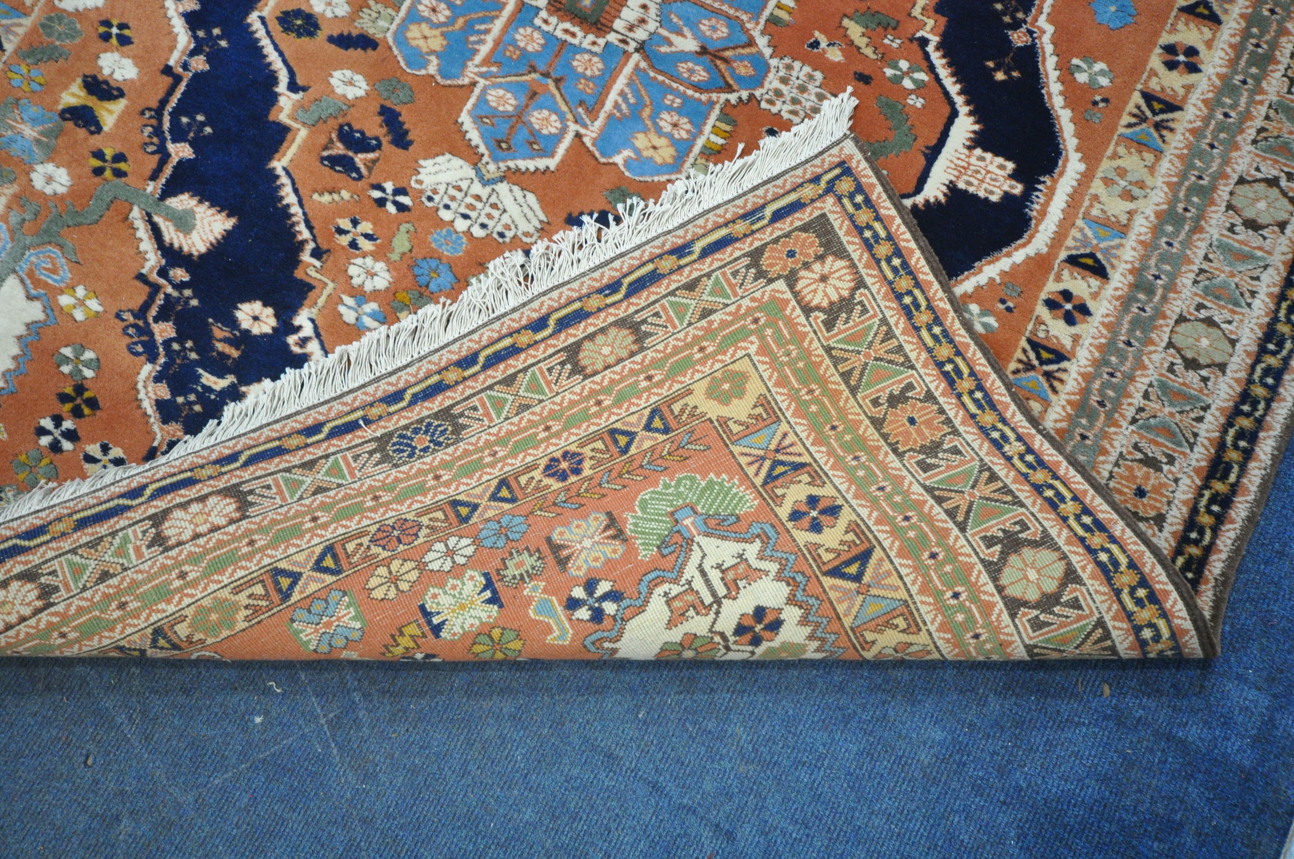 A RED GROUND PERSIAN RUG, with central medallion, repeating geometric and floral patterns, - Image 4 of 4