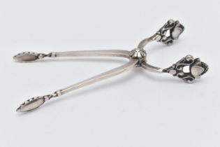 A PAIR OF GEORG JENSEN SILVER SUGAR TONGS, with stylised acorn handles, maker's marks, import mark