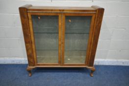 AN ART DECO WALNUT DISPLAY CABINET, the double glazed doors with geometric etched glass, enclosing