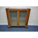 AN ART DECO WALNUT DISPLAY CABINET, the double glazed doors with geometric etched glass, enclosing