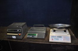 THREE ELECTRONIC GROCERS SCALES comprising of a Brecknell 112 with oval bowl, top and front
