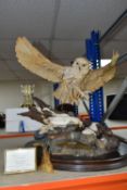 A COUNTRY ARTISTS LIMITED EDITION FIGURE OF AN OWL 'ARCTIC FLIGHT' BY RUSSELL WILLIS, CA444, no.
