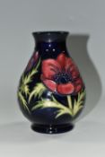 A MOORCROFT POTTERY 'ANEMONE' PATTERN VASE, of baluster form, purple and mauve flowers on a dark