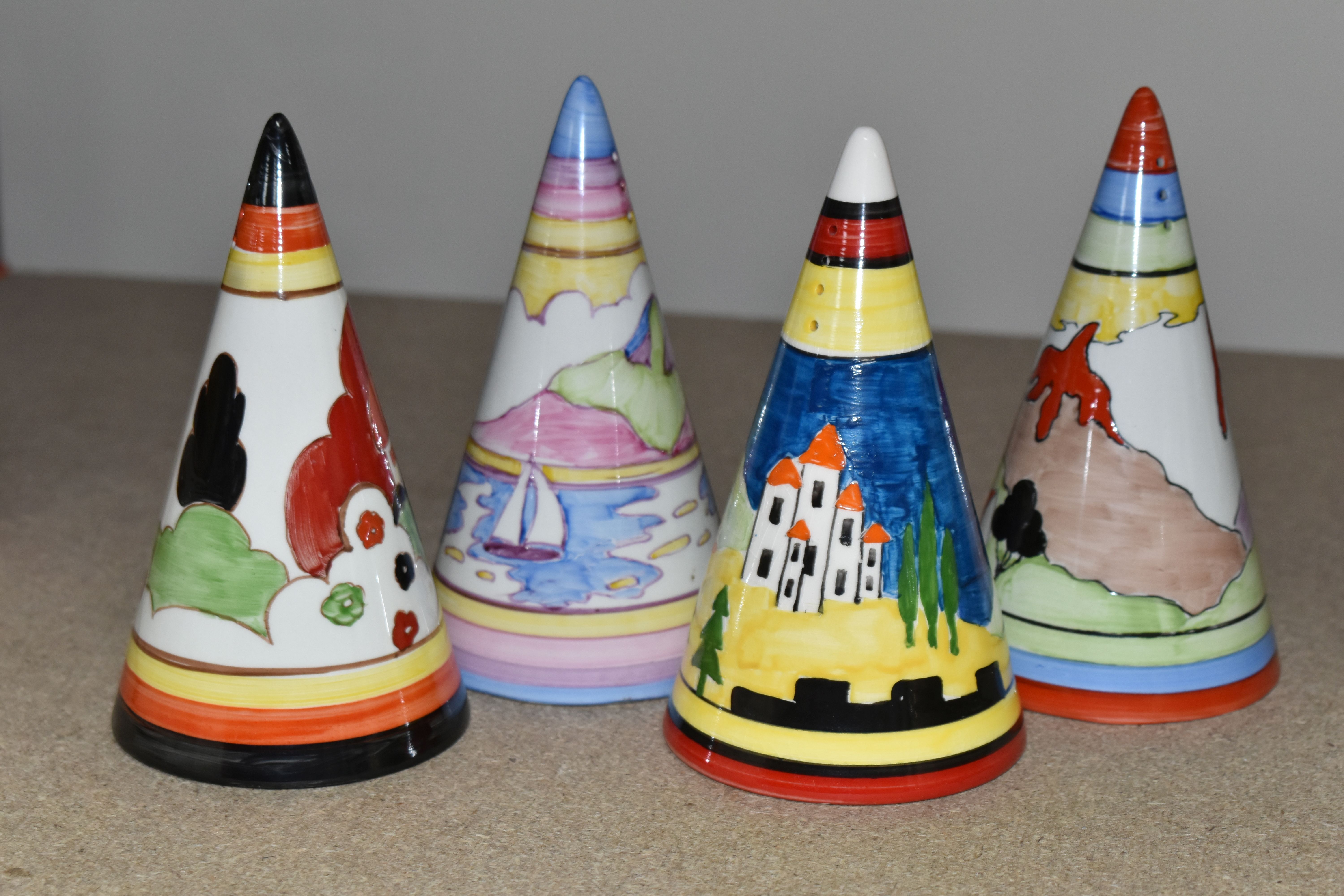 FOUR RENE DALE CONICAL SUGAR SHAKERS, one painted with a castle amongst trees and hills, one with - Image 3 of 5