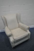 A CREAM LEATHER UPHOLSTERED WING BACK ARMCHAIR, width 82cm x depth 85cm x height 102cm (condition