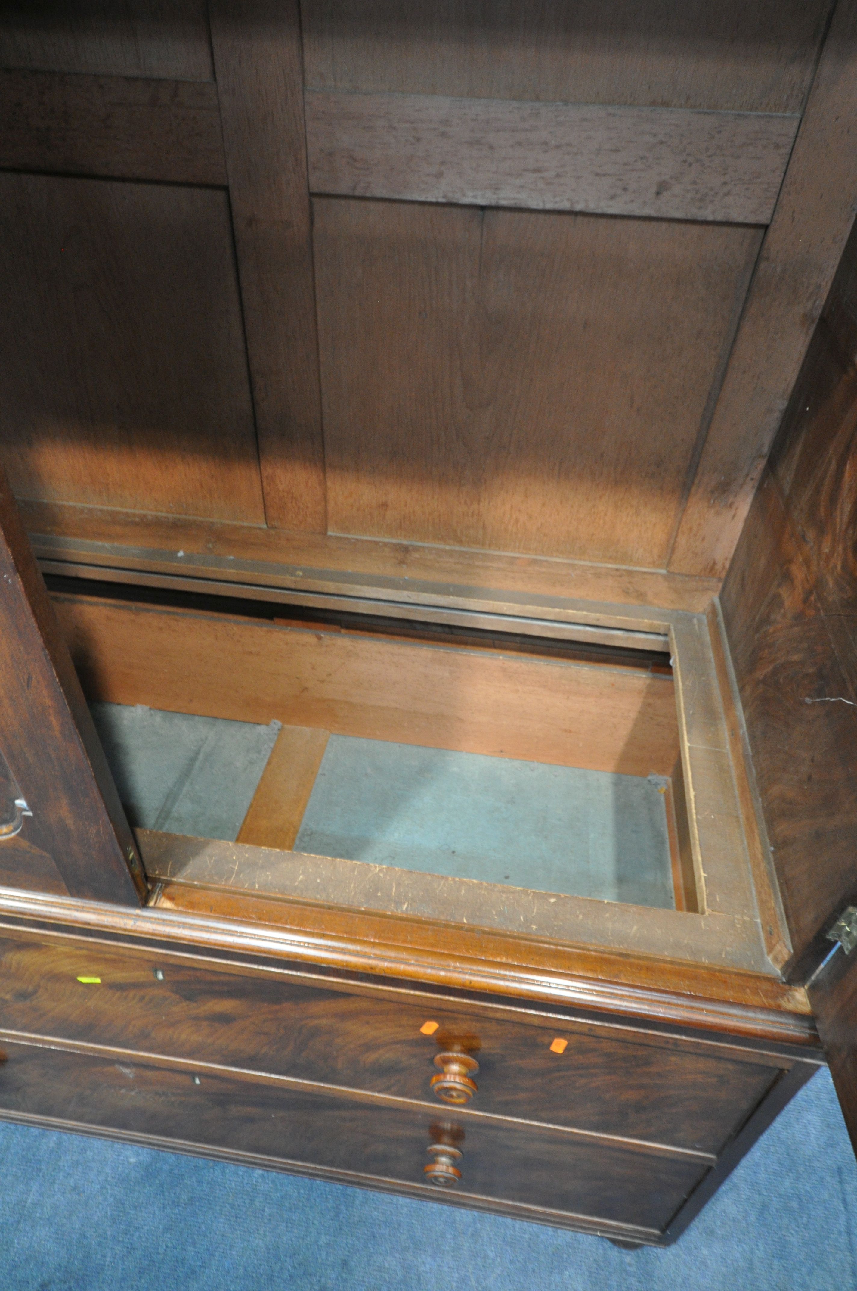 A 19TH CENTURY MAHOGANY LINEN PRESS, fitted with double cupboard doors, above two drawers, width - Image 3 of 4