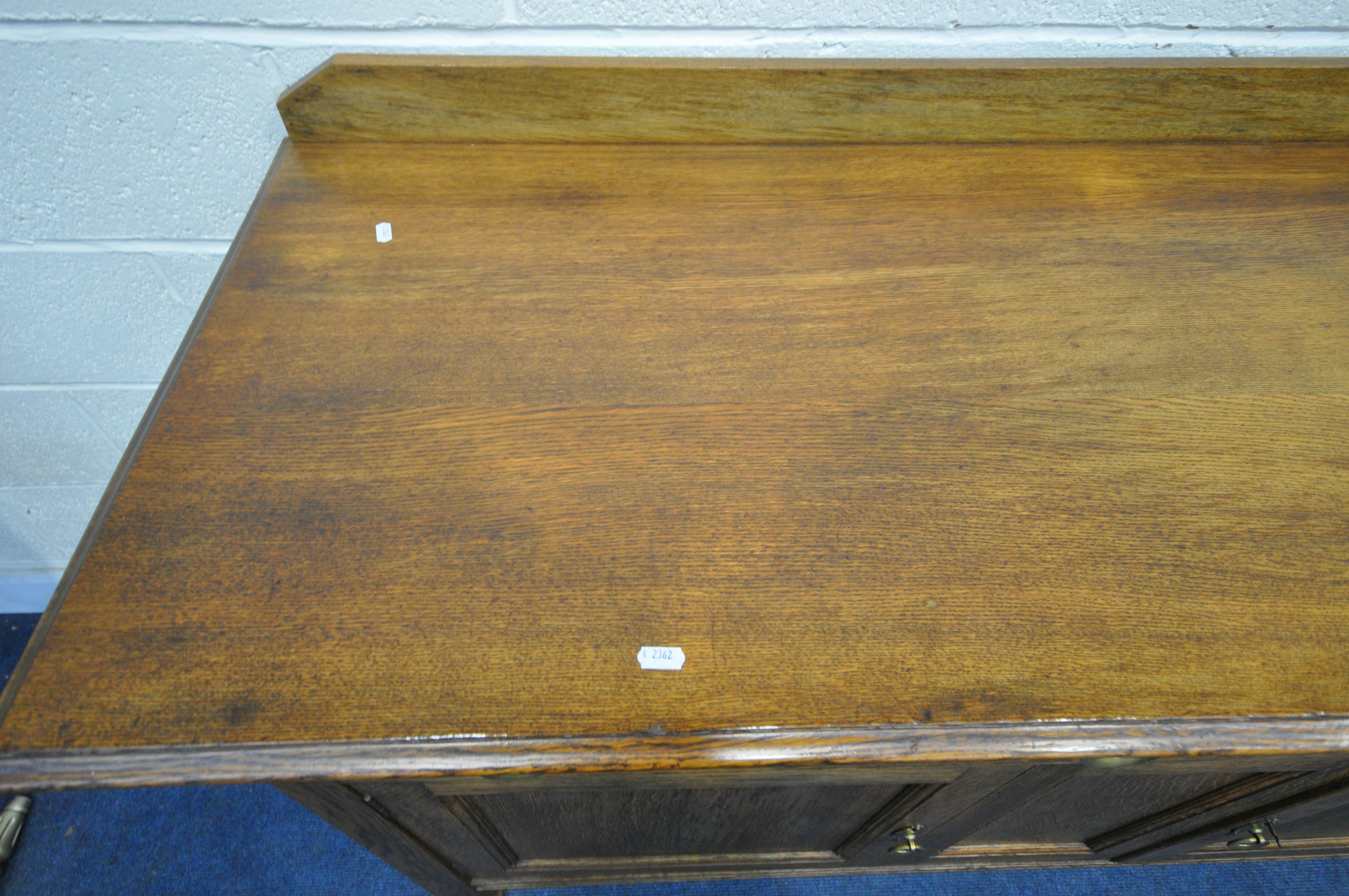 A 20TH CENTURY OAK SIDEBOARD, with a raised back, two drawers, above two cupboard doors, length - Image 2 of 4