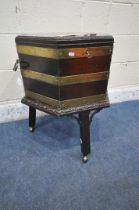 A GEORGIAN MAHOGANY HEXAGONAL CELLARETTE ON STAND, with brass banding, twin metal handles, the