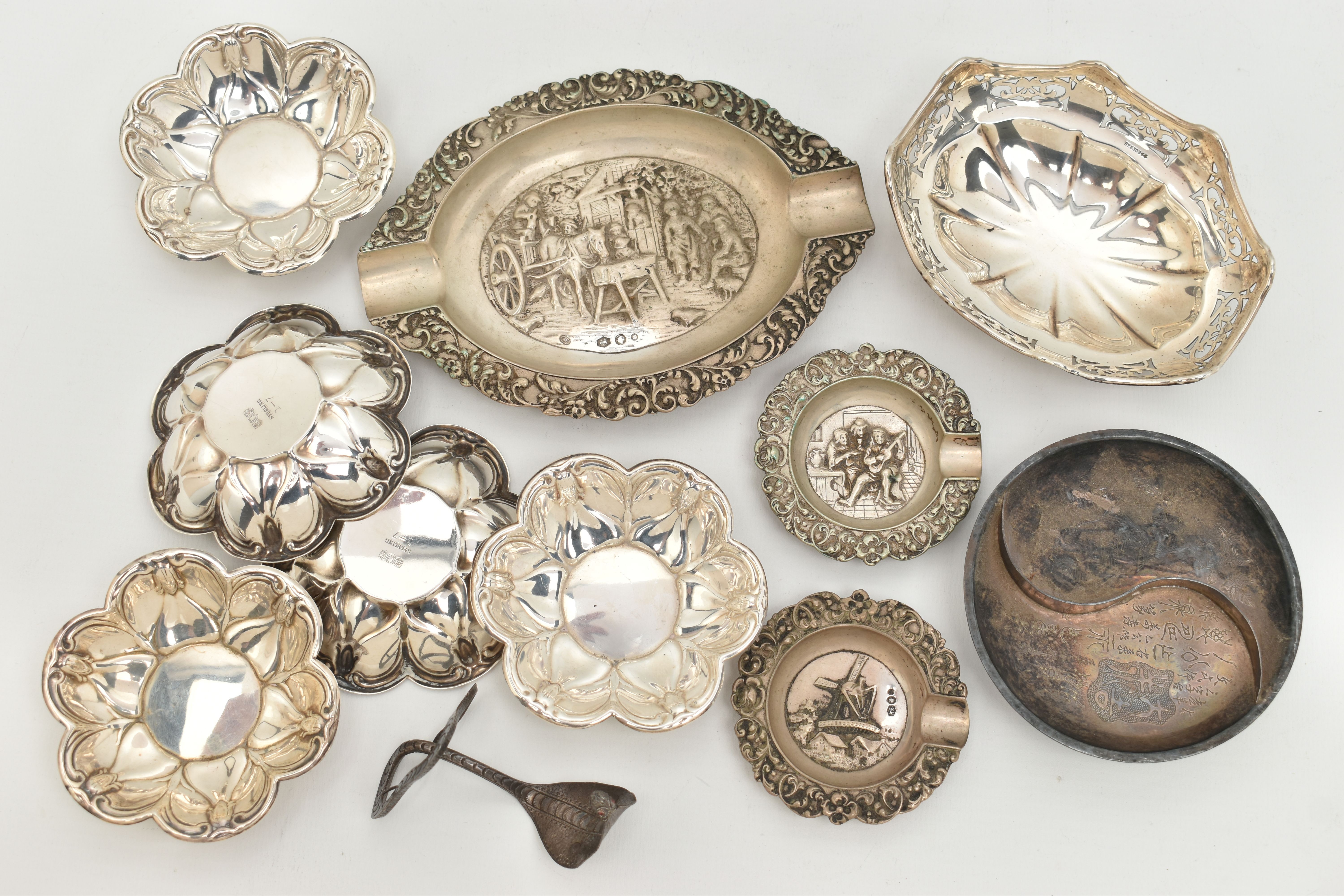 ASSORTED WHITE METAL ITEMS, to include a continental white metal oval ashtray with embossed street