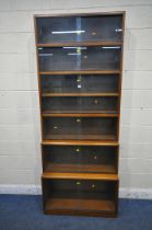 A 20TH CENTURY SIMPLEX SIX SECTION MAHOGANY STACKING BOOKCASE, all sections with double sliding