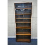 A 20TH CENTURY SIMPLEX SIX SECTION MAHOGANY STACKING BOOKCASE, all sections with double sliding