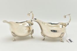 A PAIR OF GEORGE V SAUCE BOATS, typical form silver sauce boats, scalloped rim, scrolled handle with
