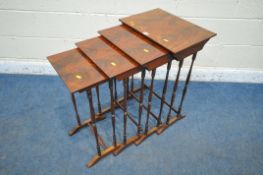 AN EARLY 20TH CENTURY FLAME MAHOGANY QUARTETTO NEST OF FOUR TABLES, raised on turned supports,