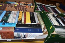 FOUR BOXES OF BOOKS, containing seventy-nine miscellaneous titles in hardback and paperback formats,