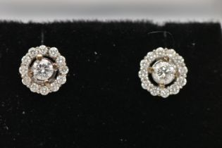 A PAIR OF 9CT WHITE GOLD DIAMOND CLUSTER STUD EARRINGS, centering on a round brilliant cut