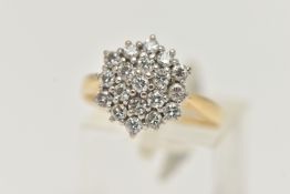 A YELLOW METAL DIAMOND CLUSTER RING, cluster set with round brilliant cut diamonds, estimated