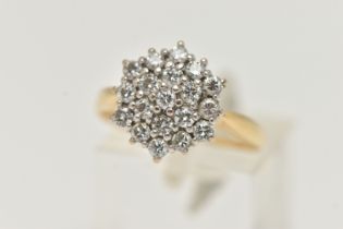 A YELLOW METAL DIAMOND CLUSTER RING, cluster set with round brilliant cut diamonds, estimated