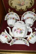 A BOXED ROYAL CROWN DERBY TEA FOR TWO SET, with Derby posies teapot and the cups, saucers, milk,