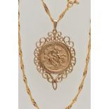 A 9CT GOLD COIN PENDANT, a George and the Dragon disk, with a scrolling open work mount,