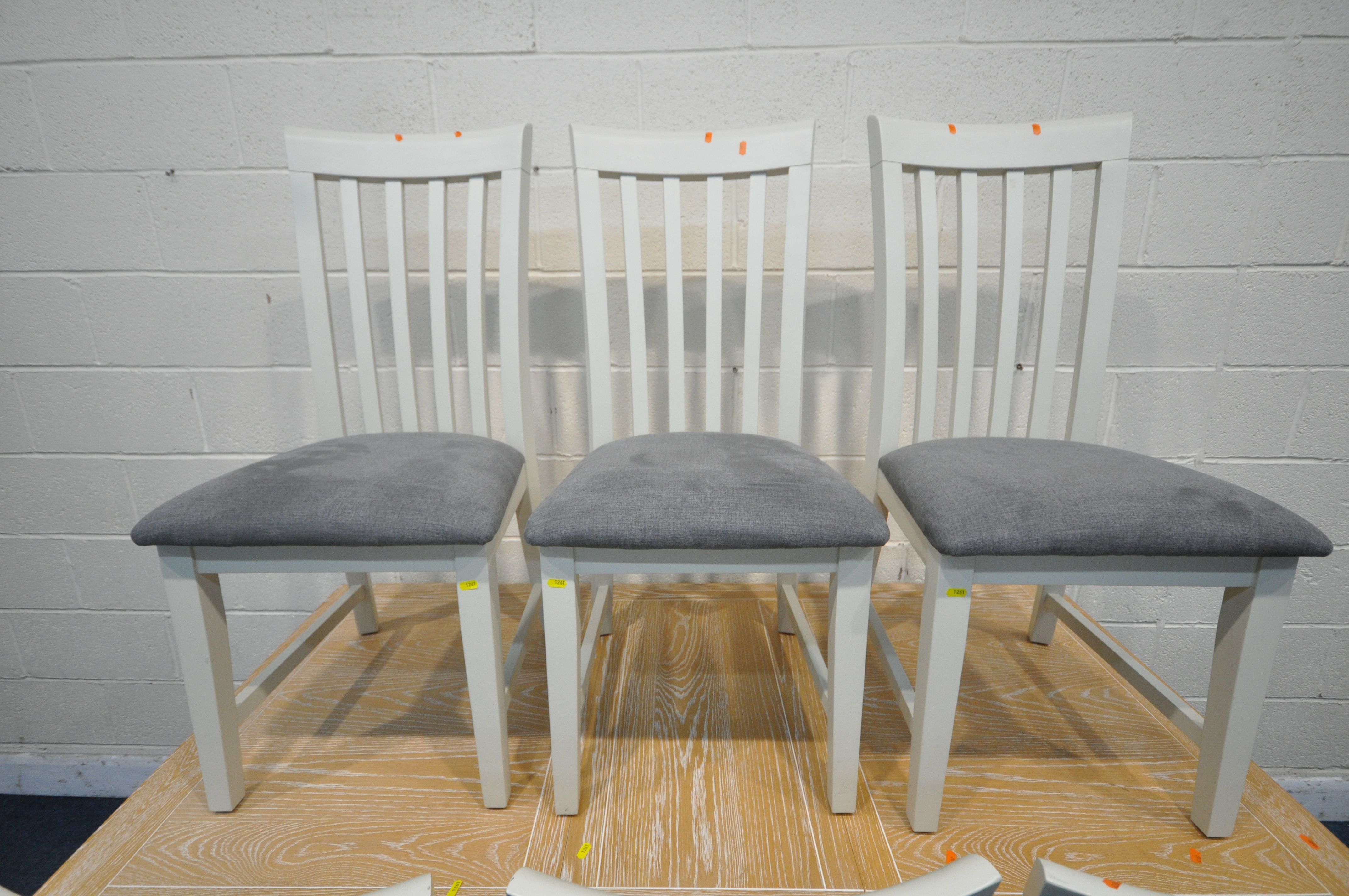 A MODERN LIMED OAK AND CREAM RECTANGULAR EXTENDING DINING TABLE, with one additional leaf, - Image 2 of 4