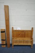 A MODERN PINE SINGLE BEDSTEAD (condition report: four bolts present, general signs of usage)