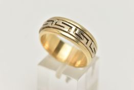A BI COLOUR GREEK RING, a yellow metal ring, fitted with a central spinning Greek key pattern,