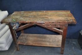 A VINTAGE WOODEN WORKSHOP BENCH with a single drawer and vice fitted width 137cm depth 60cm height