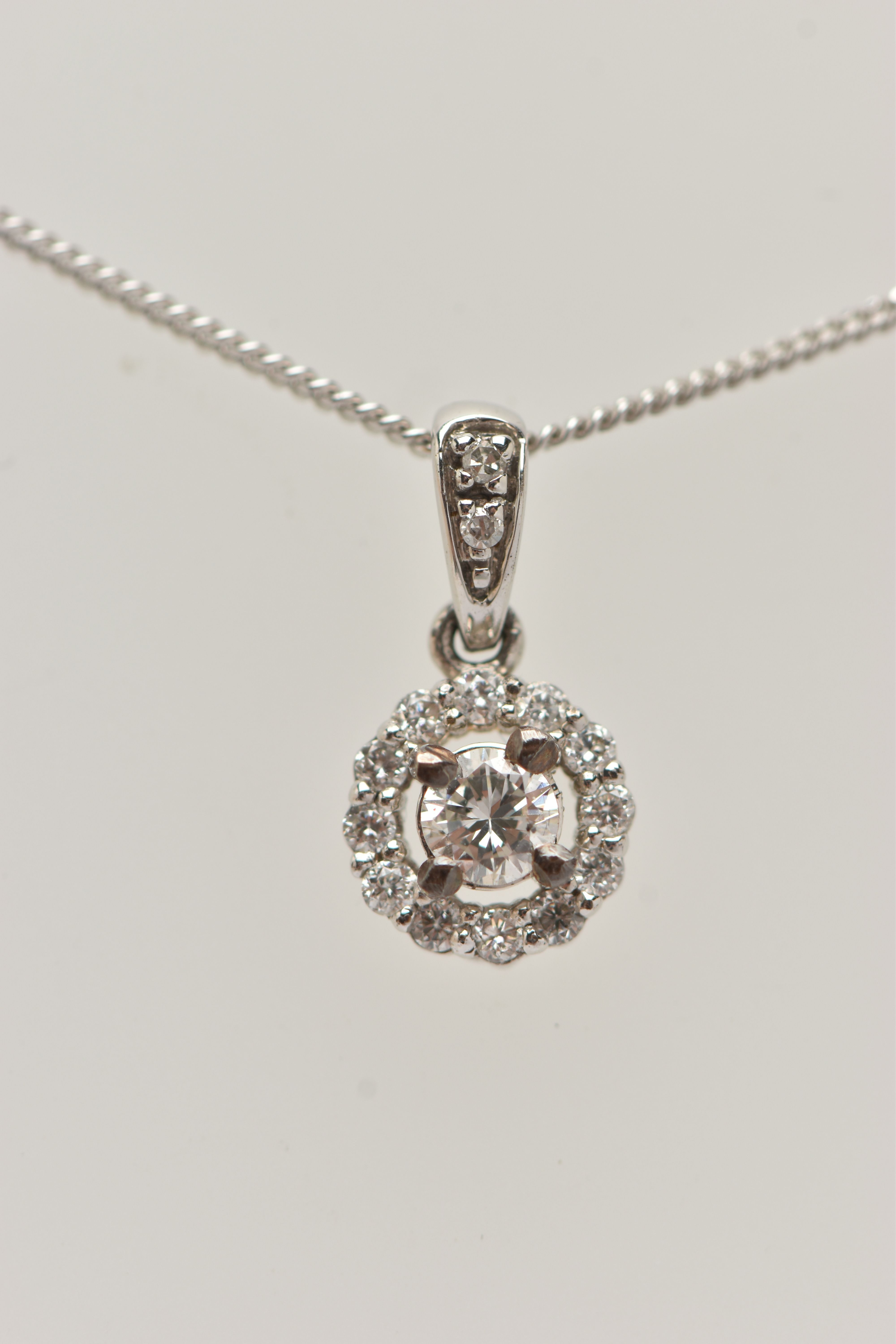 A 9CT WHITE GOLD DIAMOND PENDANT AND WHITE METAL CHAIN, a circular cluster pendant, set with a - Image 4 of 4
