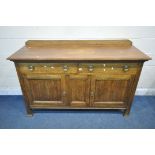 A 20TH CENTURY OAK SIDEBOARD, with a raised back, two drawers, above two cupboard doors, length