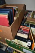 FOUR BOXES OF BOOKS containing approximately 100 titles on the subjects of music, music scores and