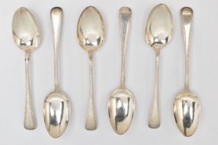 A SET OF SIX GEORGE IV SCOTTISH SILVER DESSERT SPOONS, old English pattern spoons with bright cut