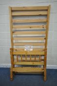 A JULIAN BOWEN PINE SINGLE BEDSTEAD (condition report: bolts present, general signs of usage)