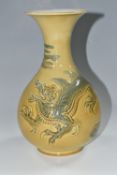 A LLADRO RELIEF MOULDED DRAGON VASE, the mustard ground decorated with a four clawed dragon, printed