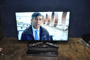 A PANASONIC TX-40HX820B 40'' ULTRA HD 4K TV with remote, a SC-HTB200 home theatre sound system