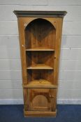 A 20TH CENTURY PINE CORNER CUPBOARD, with a single cupboard door and an arrangement of shelves,