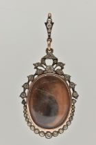A YELLOW AND WHITE METAL PASTE SET DOUBLE LOCKET PENDANT, of an oval form one side with a photo of