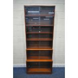 A 20TH CENTURY SIMPLEX SIX SECTION MAHOGANY STACKING BOOKCASE, all sections with double sliding
