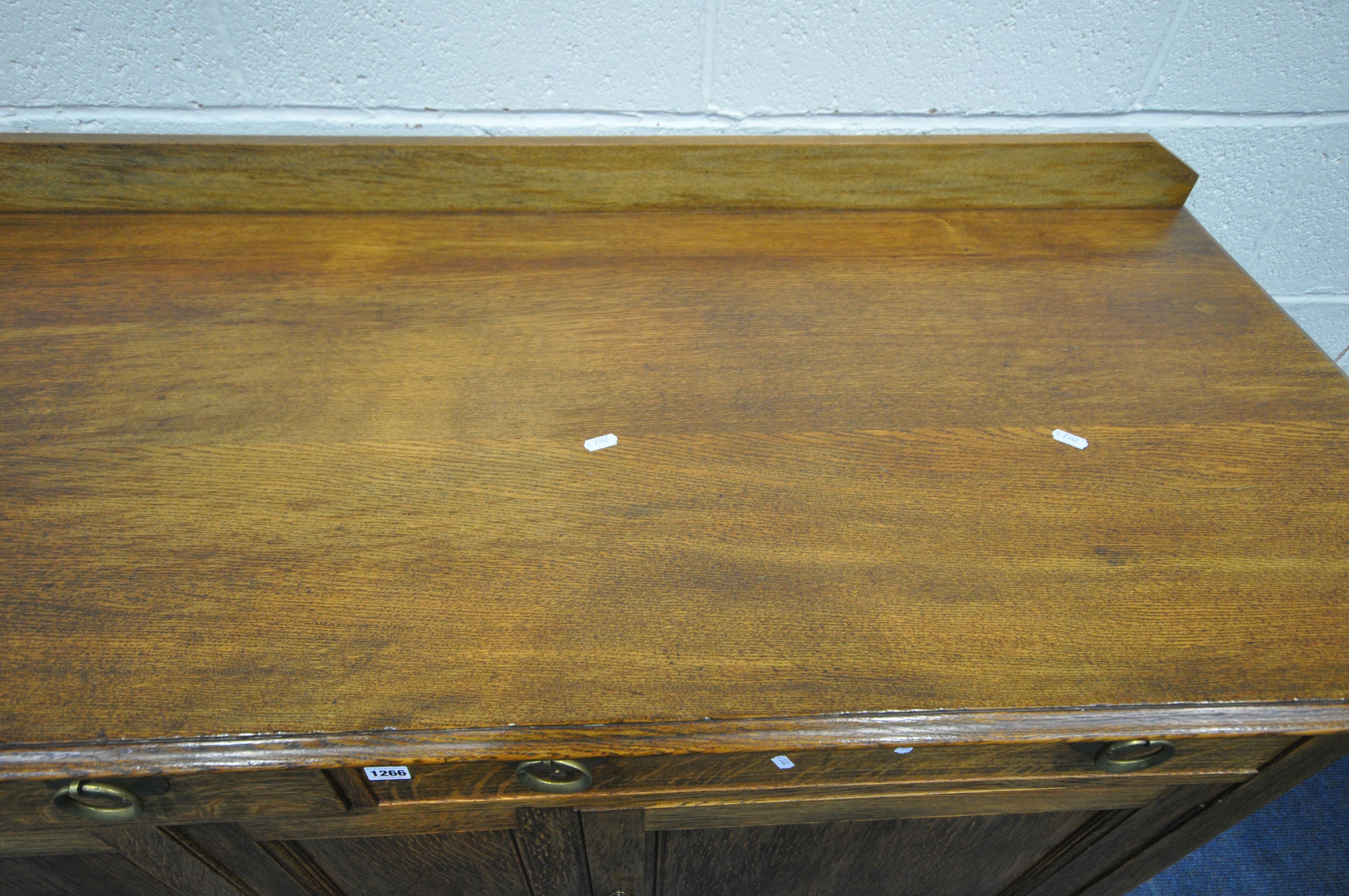 A 20TH CENTURY OAK SIDEBOARD, with a raised back, two drawers, above two cupboard doors, length - Image 3 of 4