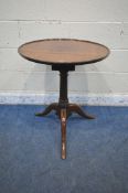A GEORGIAN MAHOGANY DISH TOP TRIPOD TABLE, with a birdcage style mechanism, raised on a turned