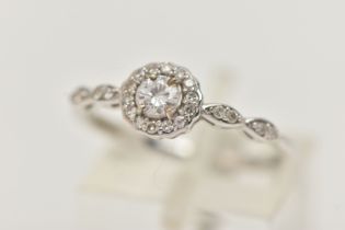 A 9CT WHITE GOLD DIAMOND RING, centering on a round brilliant cut diamond, estimated diamond