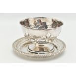 A SIVER ROSE BOWL AND A DISH, embossed pattern to the rose bowl, on a round base, hallmarked '